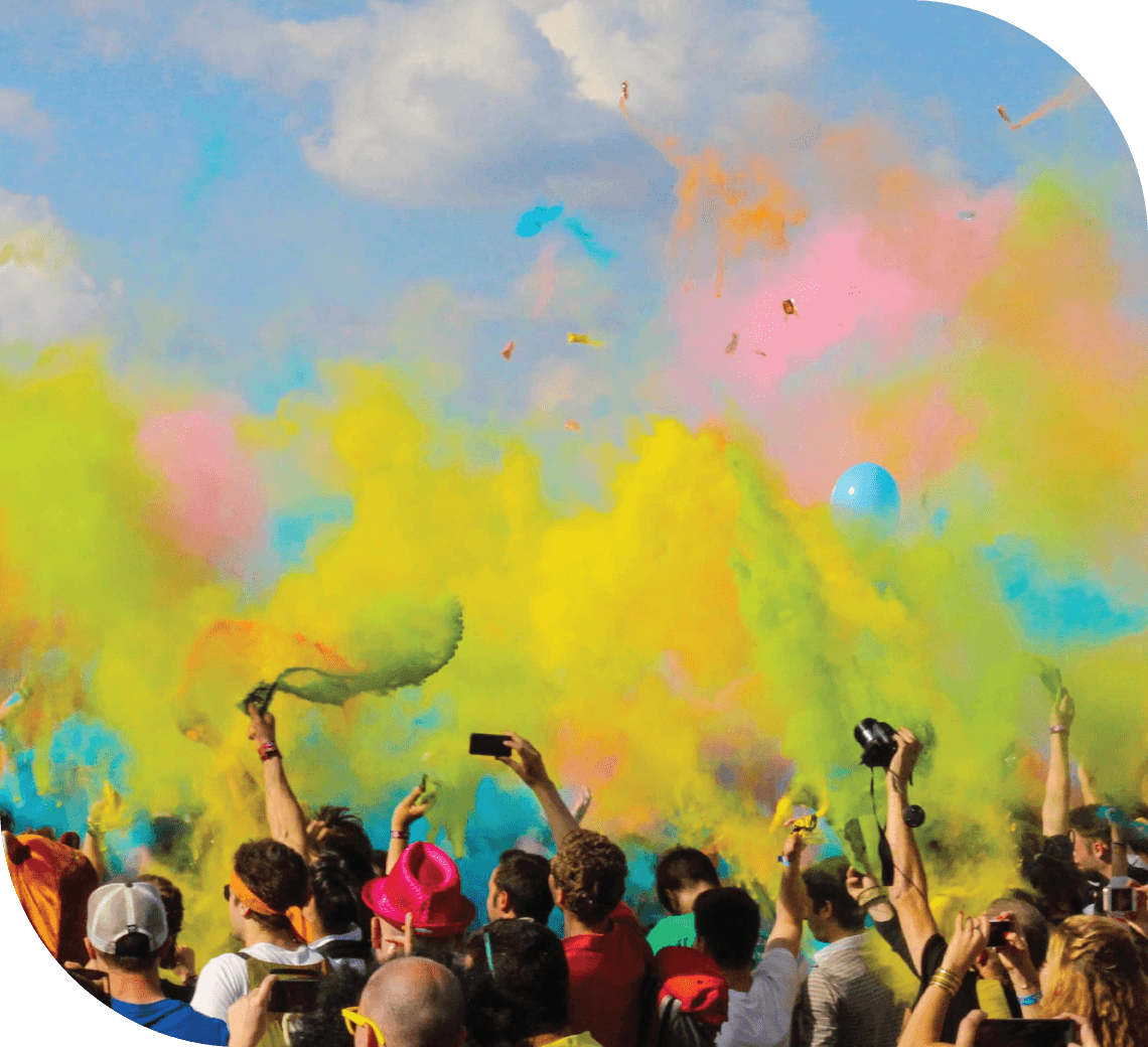 A festival crowd under bursts of sky, citrus, and green colour